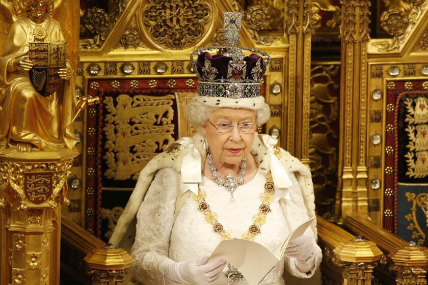 LONDON, ENGLAND - MAY 18: Queen Elizabeth II reads the Queen's Speech from the throne during State Opening of Parliament in the House of Lords at the Palace of Westminster on May 18, 2016 in London, England. The State Opening of Parliament is the formal start of the parliamentary year. This year's Queen's Speech, setting out the government's agenda for the coming session, is expected to outline policy on prison reform, tuition fee rises and reveal the potential site of a UK spaceport. (Photo by Alastair Grant - WPA Pool/Getty Images)