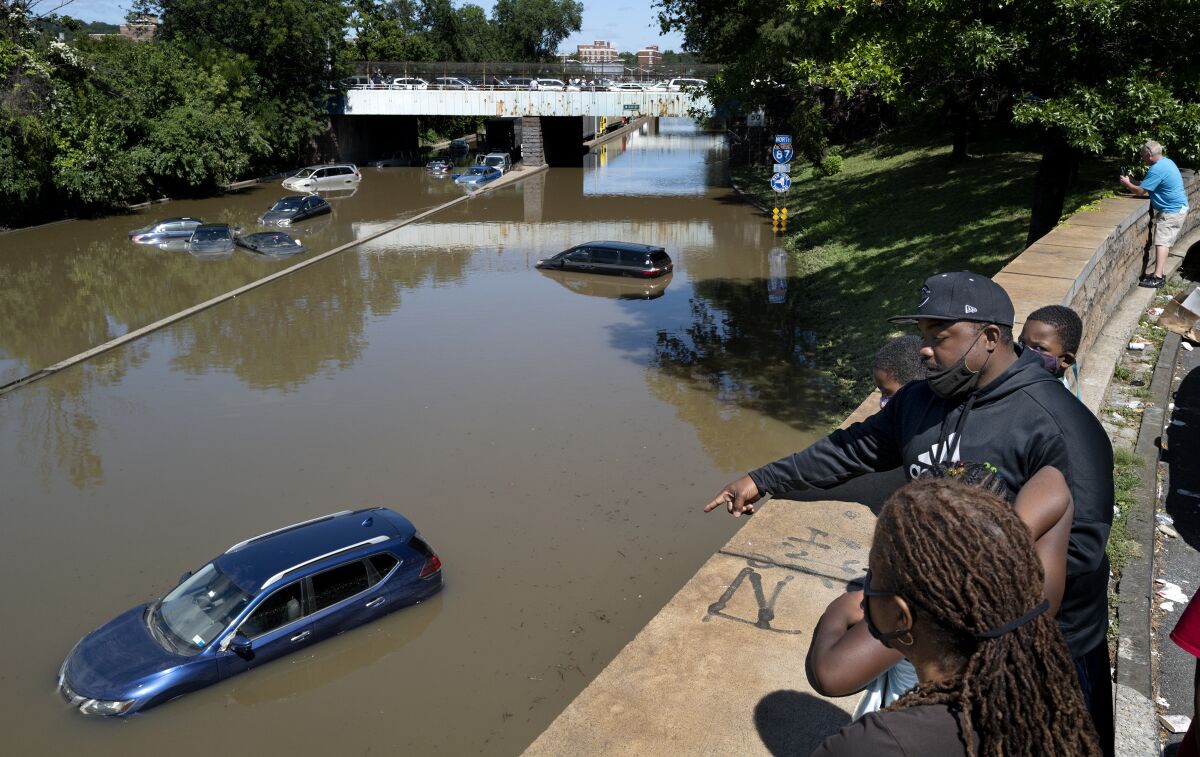 Cars and trucks are stranded by high water Thursday, Sept 2, 2021, on the Major Deegan Expressway in Bronx borough of New York as high water left behind by Hurricane Ida still stands on the highway hours later. (AP Photo/Craig Ruttle)