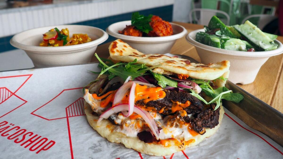 A bäco and a selection of side dishes at Bäcoshop, Josef Centeno's new Culver City restaurant.