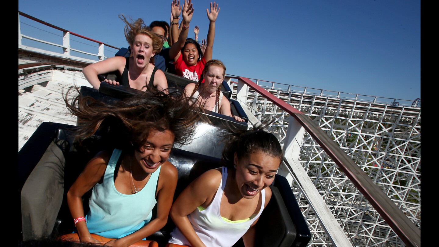 Riders head toward one of two high drops aboard the Colossus roller coaster at Six Flags Magic Mountain.