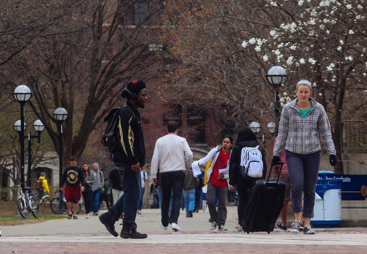 Students walk through the Ann Arbor campus of the University of Michigan in Ann Arbor, Mich. The United States Supreme Court on Tuesday upheld Michigan's ban on affirmative action enacted by voters in 2006.