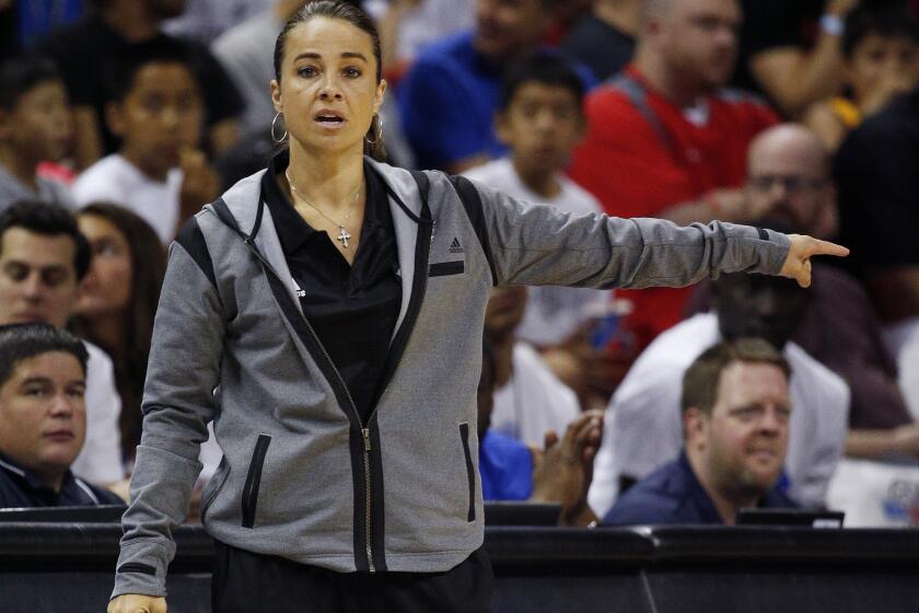 Becky Hammon coaches the San Antonio Spurs during the first half of an NBA summer league basketball game against the Boston Celtics on July 18.