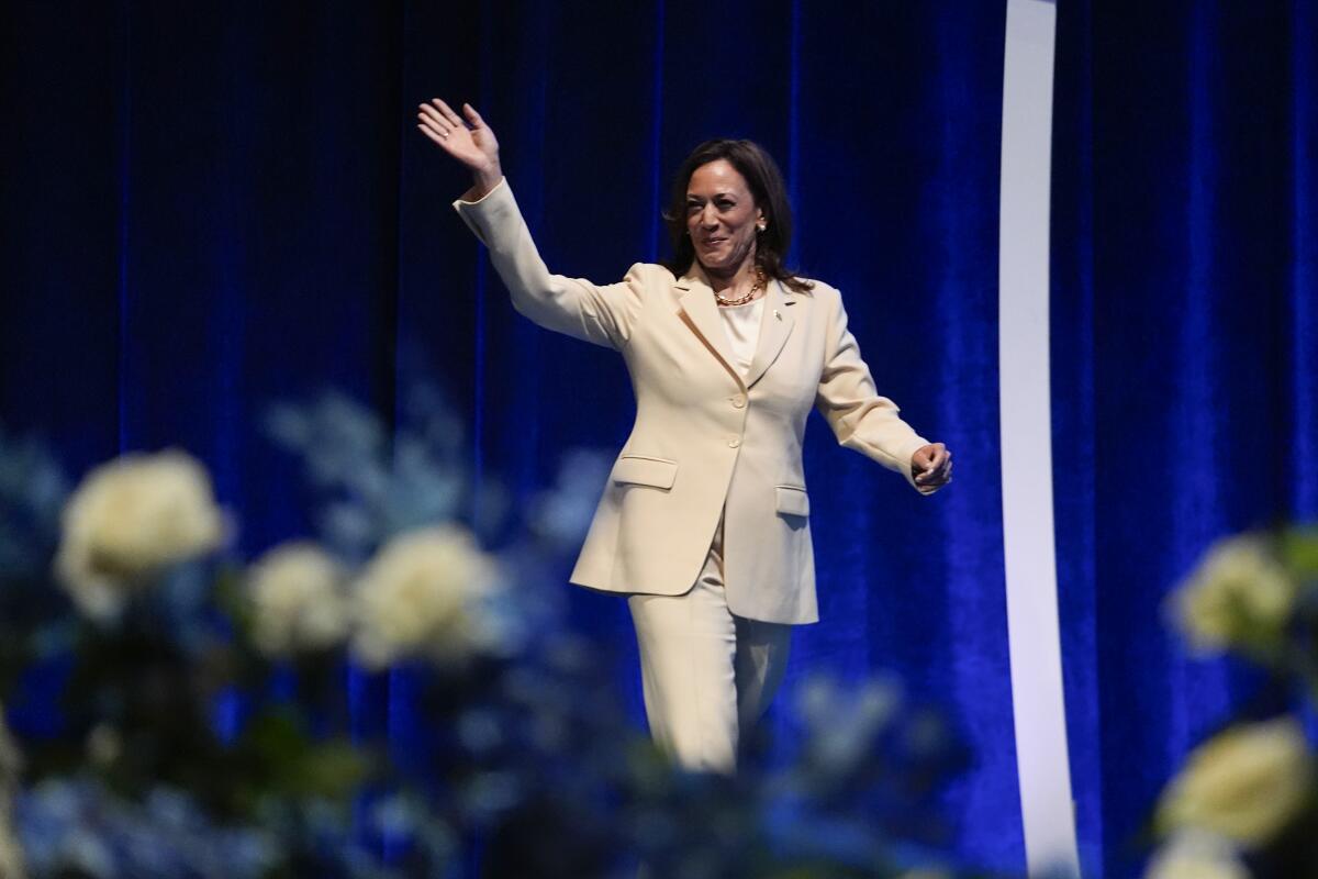 Vice President Kamala Harris waves as she is introduced during the Zeta Phi Beta Sorority Inc.'s Grand Boulé in Indianapolis.