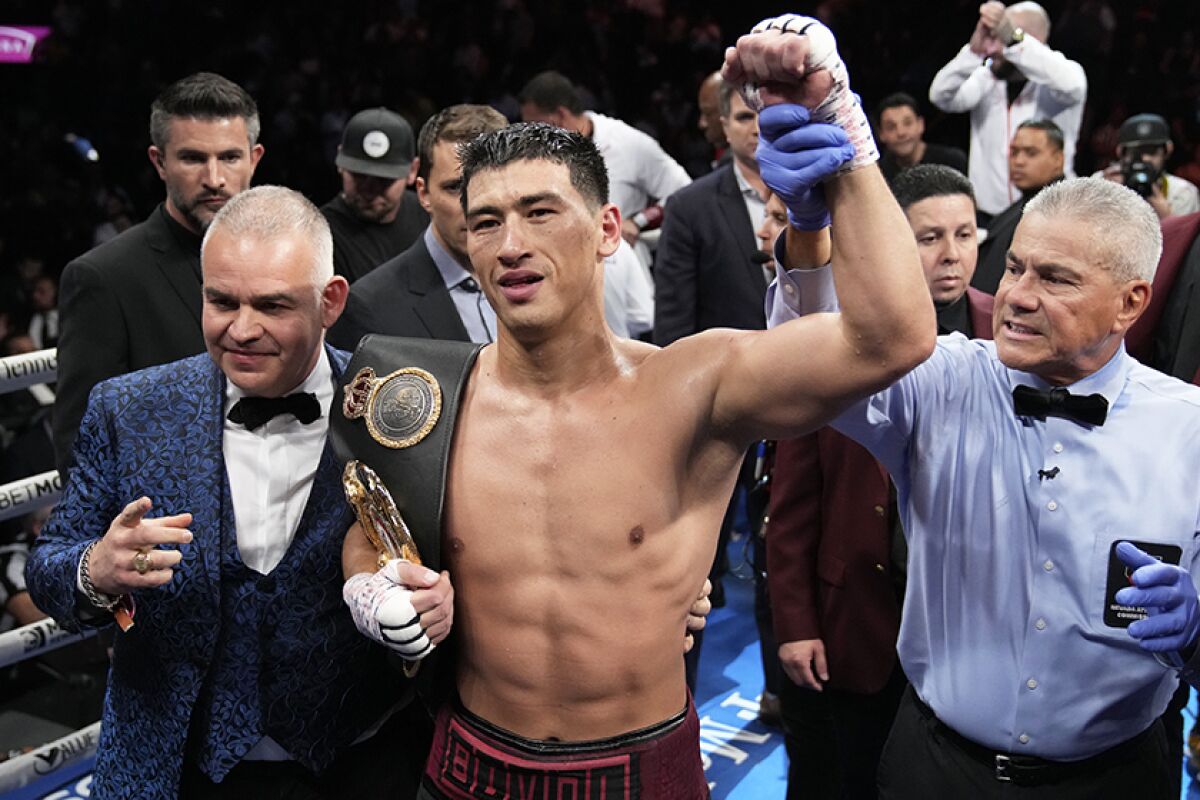 Dmitry Bivol celebrates after his victory by unanimous decision Saturday night.