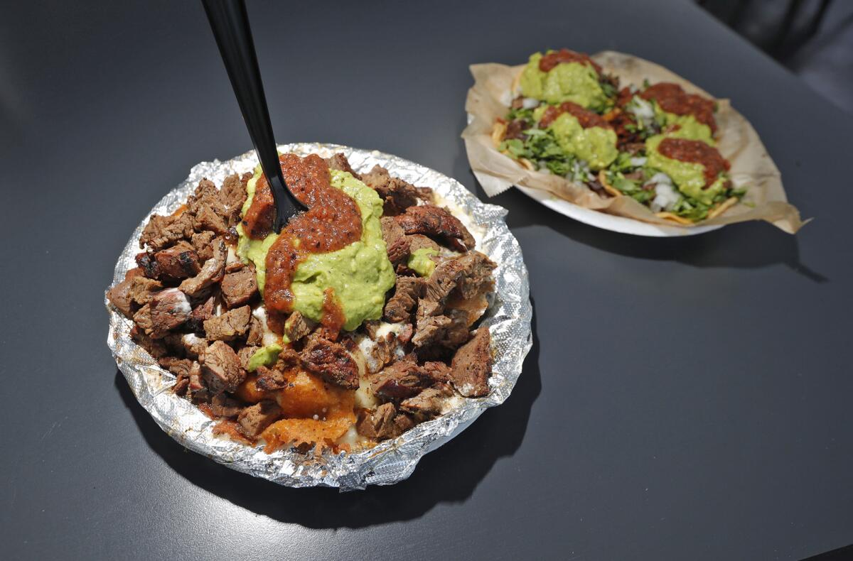 The popular Papa Loka and Taco Tuesday plates at Tacos Los Cholos in Anaheim. 