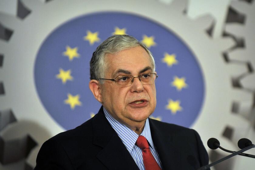 Former Greek Prime Minister Lucas Papademos speaks at a conference organised by the European Commission in Athens on April 20, 2012.