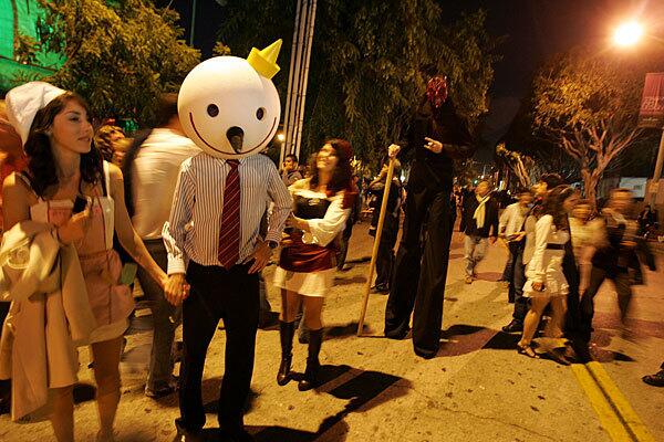 Thousands of Halloween revelers, including someone dressed as Jack from Jack-in-the-Box, line Robertson Boulevard near Santa Monica Boulevard during the 2009 West Hollywood Halloween Costume Carnaval.