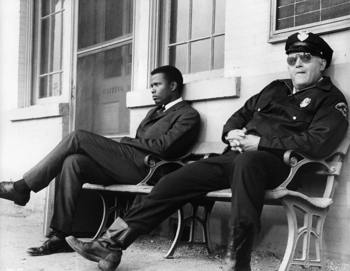 Sidney Poitier and Rod Steiger in 1967's "In The Heat Of The Night', 1967. (Photo by United Artists/Getty Images)