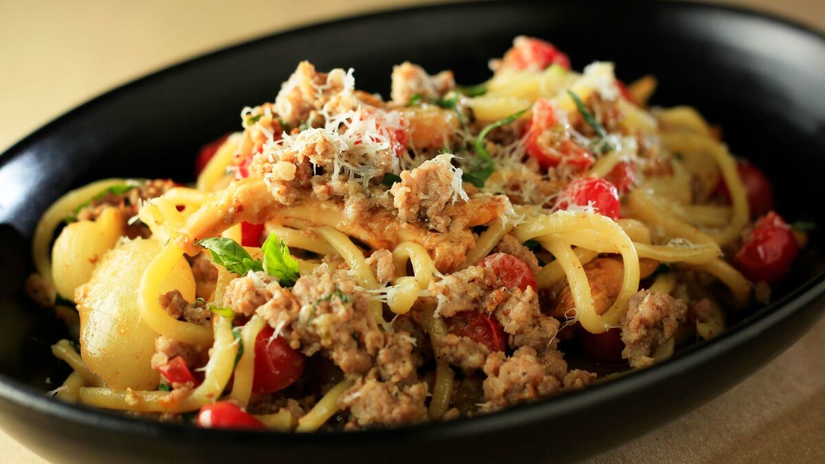 Spaghetti With Sausage, Cippolini, Chanterelle and Cherry Tomato, created by Joe Magnanelli.