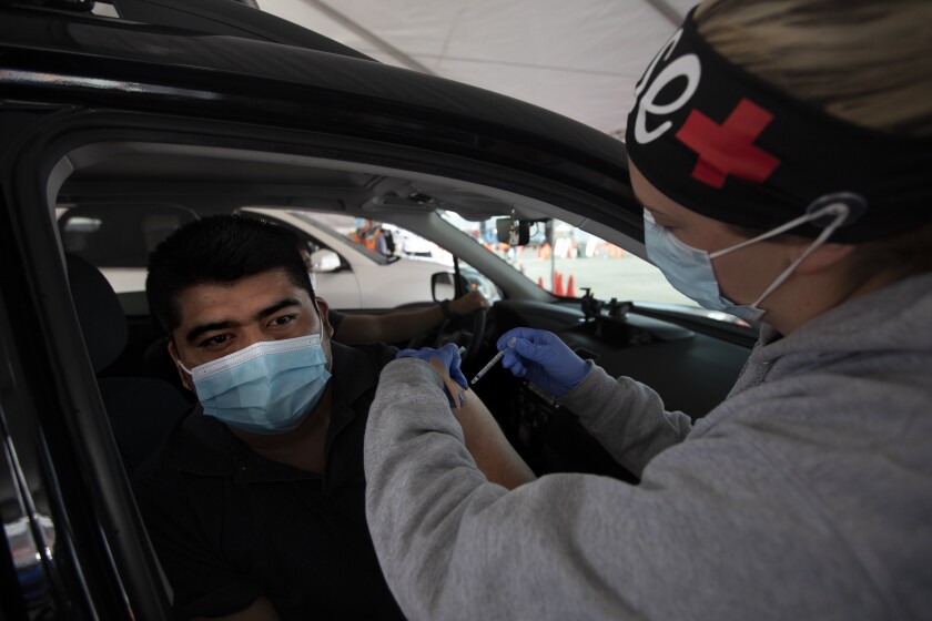 From standby lists to volunteering: Alternate ways you can
get a COVID-19 vaccine 2 DOWNEY, CA - MARCH 13: Kayla Cox, LVN, right, gives Silvestre Dionocio, left, a vaccine at the LA County Covid-19 vaccine site located at the County Office of Education on Saturday, March 13, 2021 in Downey, CA. (Francine Orr / Los Angeles Times)