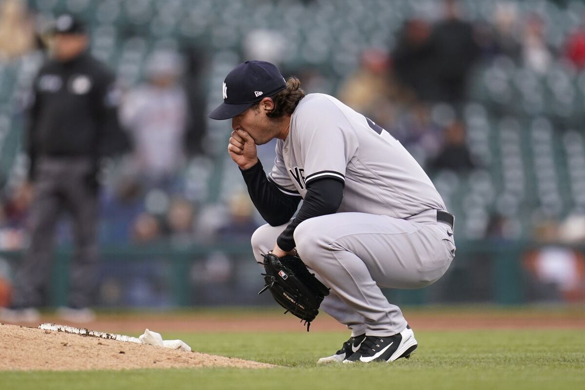 New York Yankees pitcher Gerrit Cole reacts after allowing a walk to Detroit Tigers' Willi Castro with the bases loaded in the second inning of a baseball game in Detroit, Tuesday, April 19, 2022. (AP Photo/Paul Sancya)