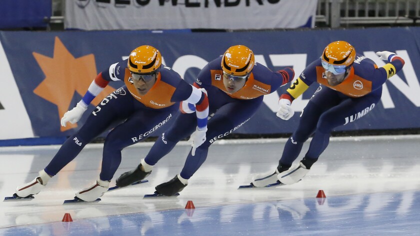 FILE - From left to right, Netherlands' Dai Dai Ntab, Kai Verbij and Thomas Krol race during the men's team sprint competition at the world single distances speedskating championships Feb. 13, 2020, in Kearns, Utah. Krol believed he was going to the Olympics four years ago. The speedskater finished third at the Dutch trials, and then politics intervened. The national federation named Verbij to the team for Pyeongchang. Verbij was injured at the trials and unable to compete in the 1,000 meters, but he was chosen over Krol. (AP Photo/Rick Bowmer, File)