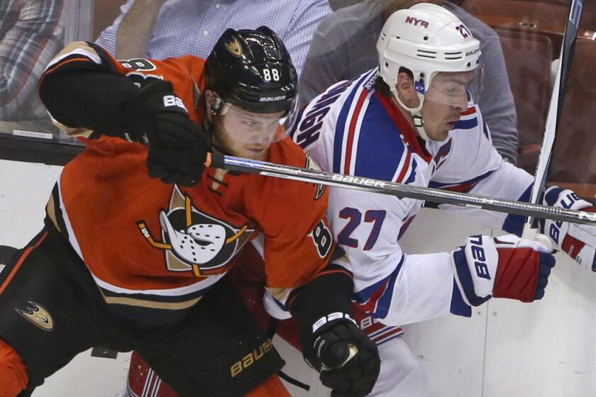 Anaheim Ducks left wing Jamie McGinn slams a check into New York Rangers defenseman Ryan McDonagh during the second period on Wednesday.