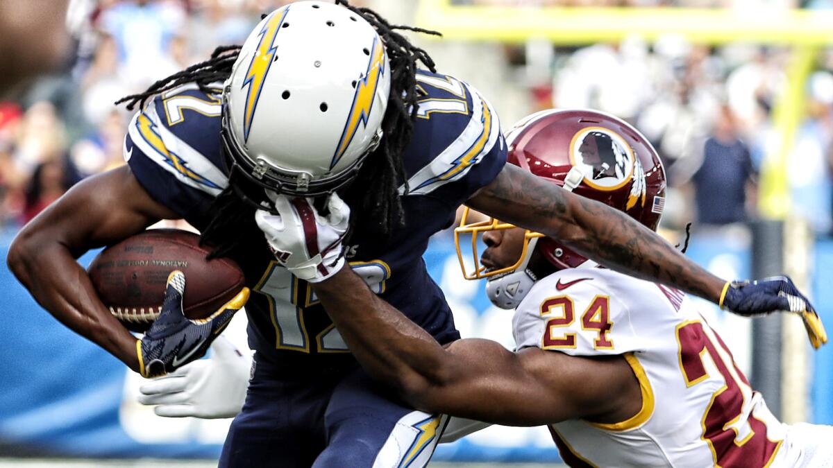 Redskins cornerback Josh Norman pulls on the face mask of Chargers receiver Travis Benjamin, drawing a penalty, during a Nov. 10 game at StubHub Center.
