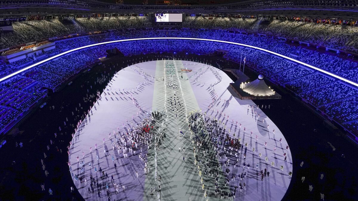 Athletes march in during the opening ceremony at the Olympic Stadium.