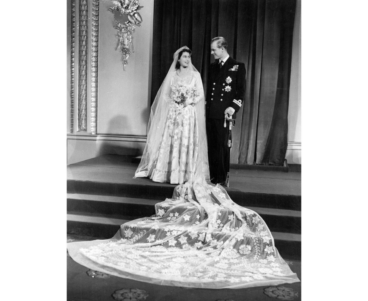 Elizabeth and Philip pose for the official wedding picture, taken after their return to Buckingham Palace.