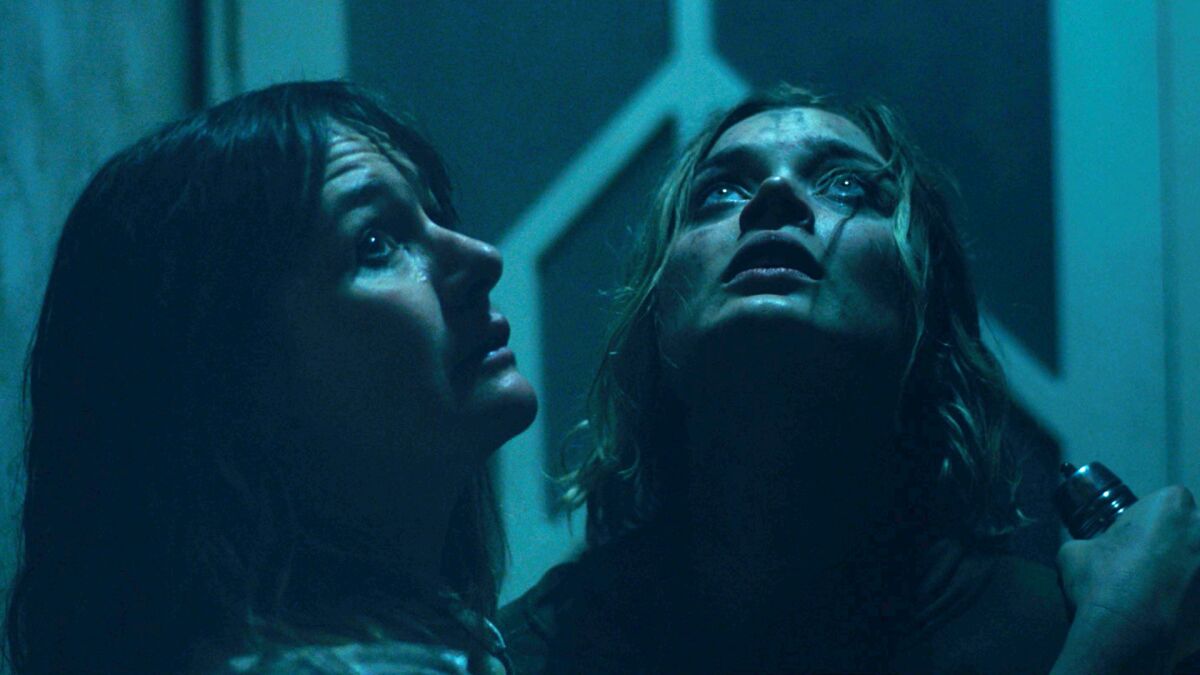 Emily Mortimer and Bella Heathcote in a scene from "Relic."