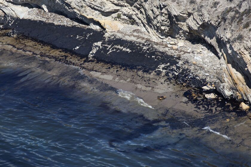 Oil stains on the shore near Refugio State Beach near Santa Barbara. A fisherman has filed suit against the operator of the pipe that burst in May.