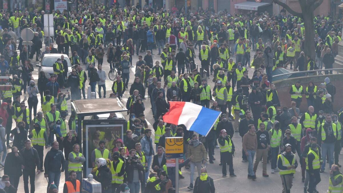 The Gilets Jaunes, or Yellow Vests, movement, in which protesters wear bright yellow vests, started initially as a reaction to the planned tax on diesel fuel set to take effect in January as part of the French president's efforts to fight climate change.