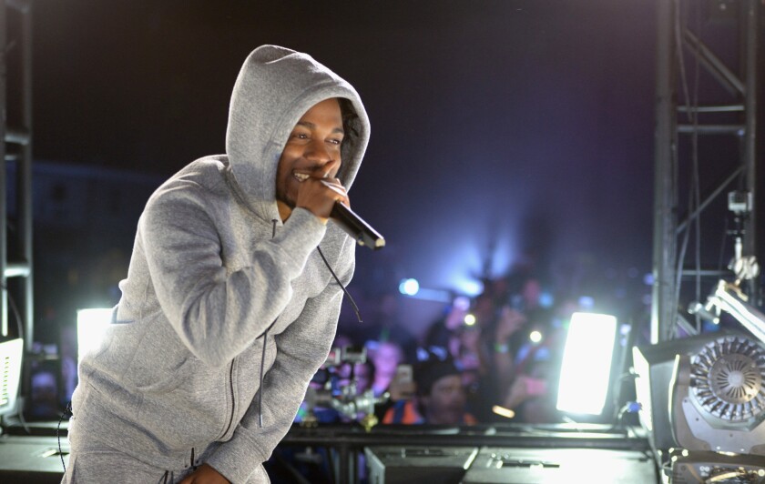 Kendrick Lamar at a March street concert in West Hollywood organized by Reebok. On Monday, the Compton hip-hop artist was commended in the California Senate for his charitable work.