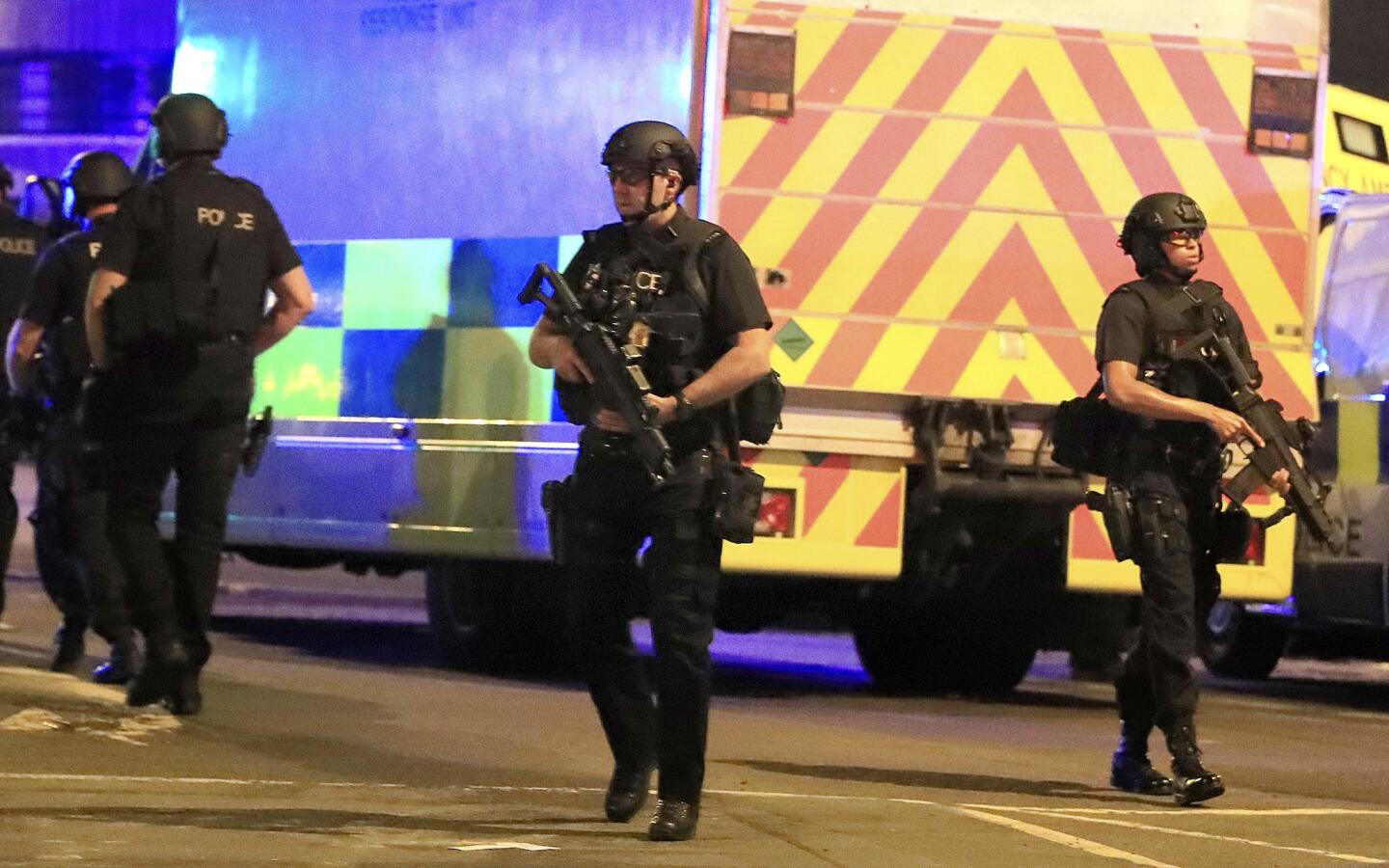 Armed police respond after reports of an explosion at Manchester Arena during an Ariana Grande concert in Manchester, England, Monday, May 22, 2017. Several people have died following reports of an explosion Monday night at the concert in northern England, police said. A representative said the singer was not injured.