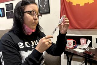 June Voros prepares insulin for her pump, which is then attached to her abdomen and delivers a steady stream of insulin to her body. (Angela Hart/KFF Health News)