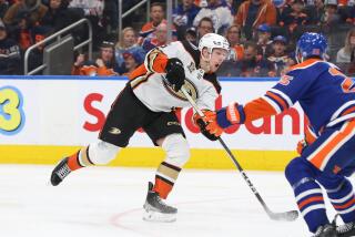 EDMONTON, CANADA - MARCH 30: Urho Vaakanainen #5 of the Anaheim Ducks shoots.