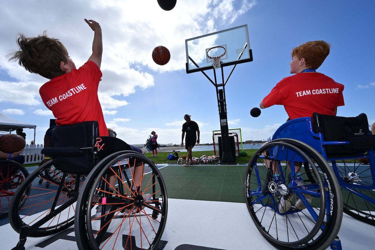 Children take part in a Challenged Athletes Foundation wheelchair basketball clinic on Saturday, Oct. 22, near Mission Bay.