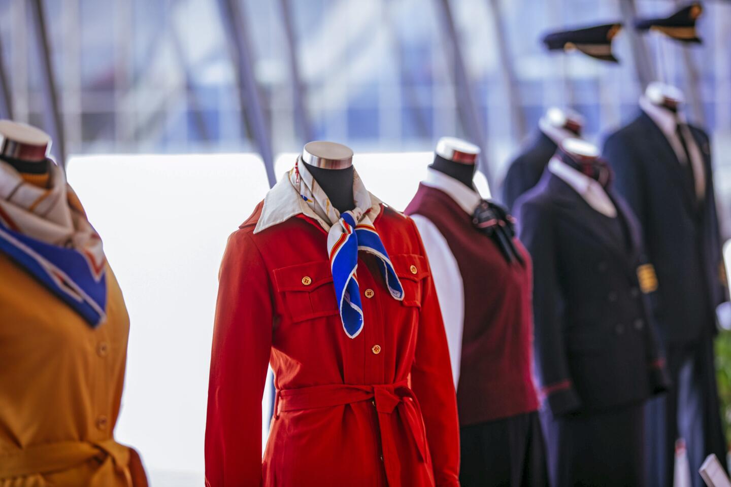 Vintage TWA uniforms are displayed in the new TWA Hotel at JFK.