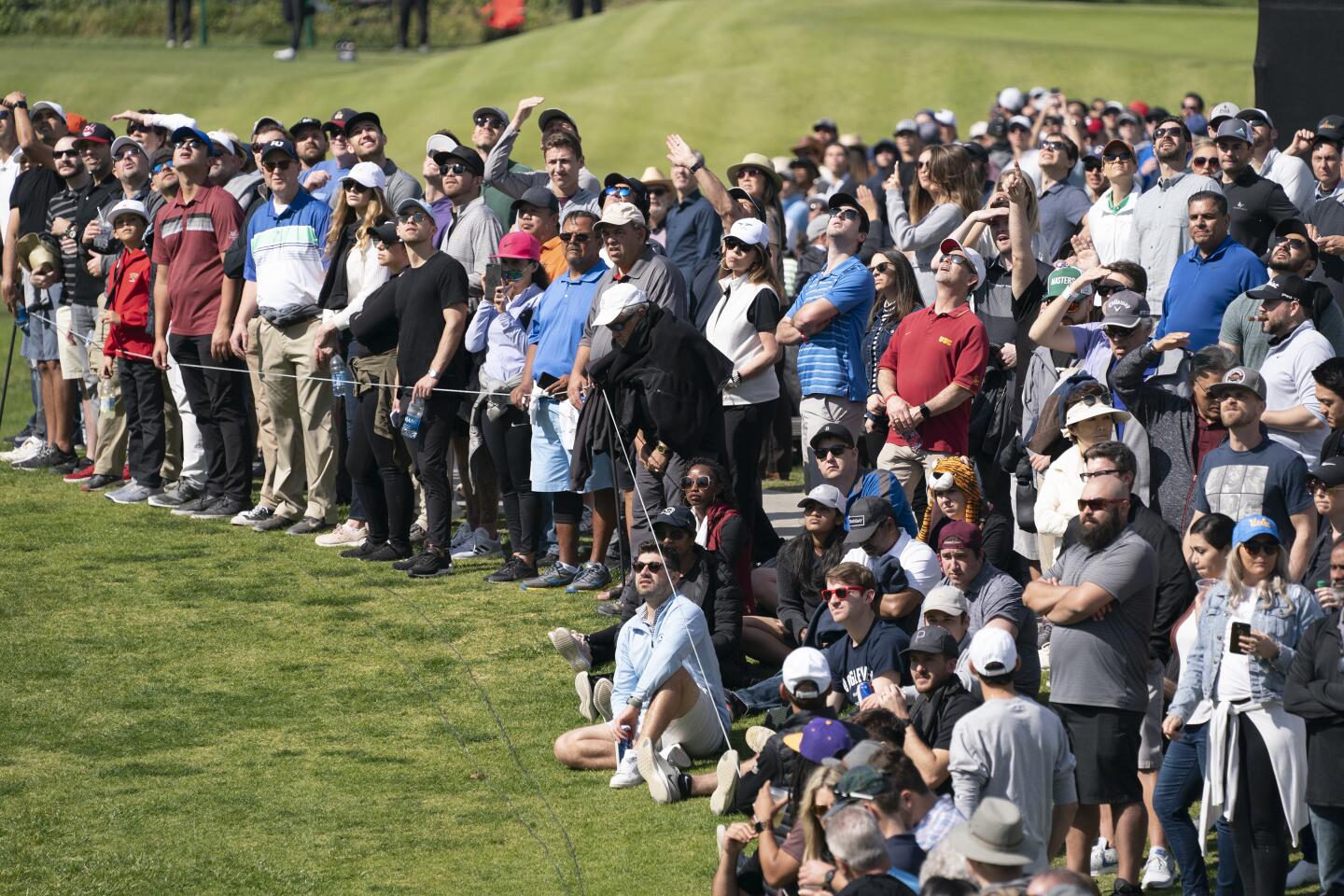 The gallery watches a drive by Tiger Woods on the sixth hole during the third round of the Genesis Invitational at Riviera Country Club on Feb. 15, 2020.
