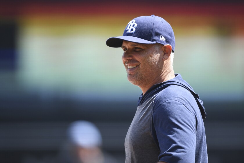 Tampa Bay Rays manager Kevin Cash watches players before a game.