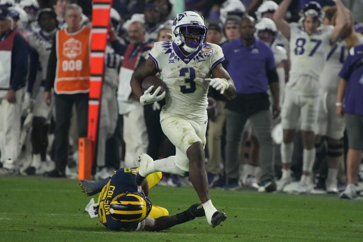 TCU running back Emari Demercado carries the ball during a win over Michigan in the Fiesta Bowl on Dec. 31.