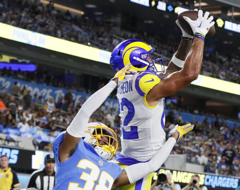 Rams wide receiver Lance McCutcheon catches a touchdown pass over Chargers cornerback Brandon Sebastian.