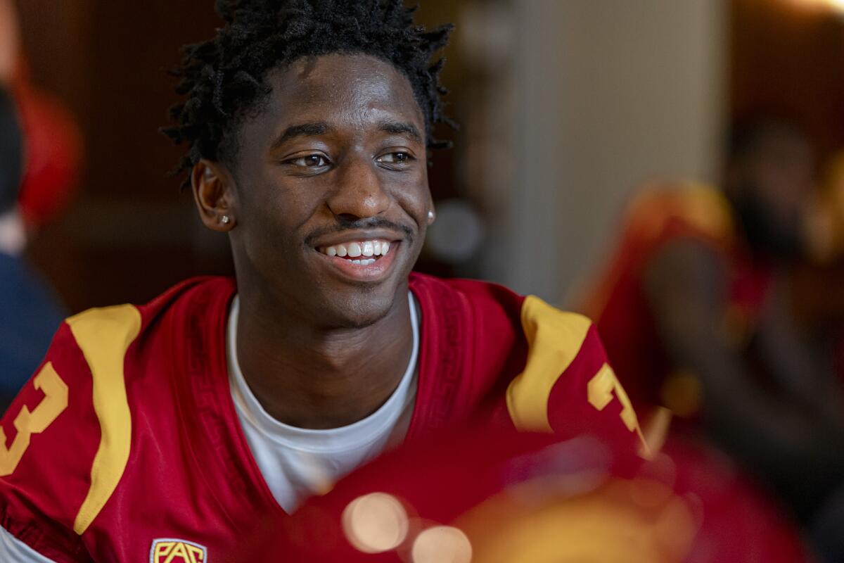 USC wide receiver Jordan Addison talks with reporters on media day.