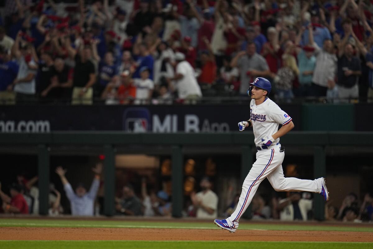 Texas Rangers' Corey Seager runs the bases after hitting a solo home run.