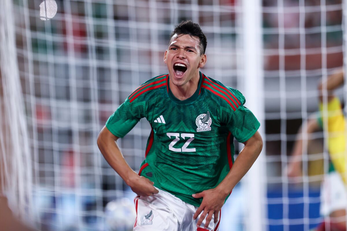 Mexico's Hirving Lozano celebrates after scoring against Peru at the Rose Bowl on Sept. 24, 2022.