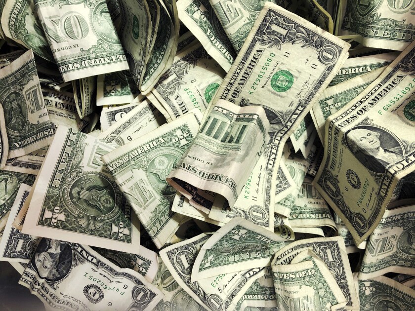 A pile of dollar bills.