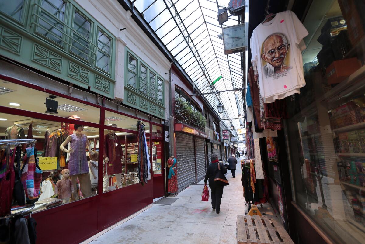 People walk in Paris through the "Passage Brady" (passageway) which leads to the Strasbourg boulevard.