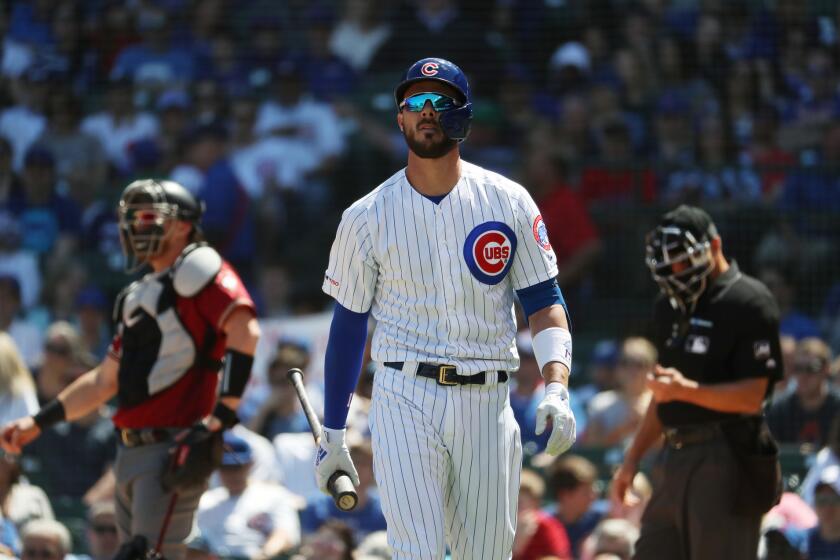 Cubs third baseman Kris Bryant walks to the dugout after striking out against the Diamondbacks on April 21, 2019, at Wrigley Field.