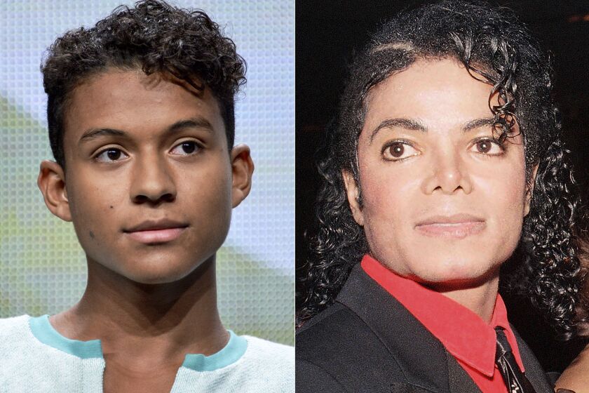 Jaafar Jackson appears during the "Living with The Jacksons" panel at the Reelz Channel 2014 Summer TCA in Beverly Hills, Calif., on July 12, 2014, left, and Michael Jackson appears at the American Cinema Award gala in Beverly Hills, Calif., on Jan. 9, 1987. Michael Jackson's 26-year-old nephew, Jaafar, will play the King of Pop in a planned biopic to be directed by Antoine Fuqua. (AP Photo)