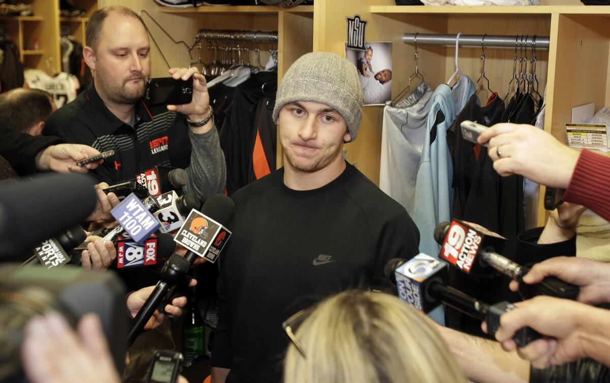 Cleveland Browns quarterback Johnny Manziel talks with reporters on Dec. 29.