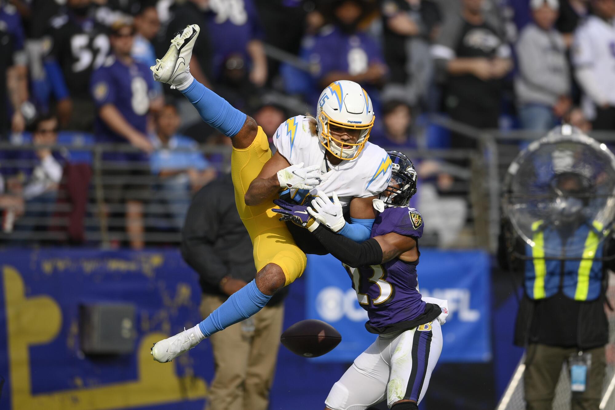 Baltimore Ravens cornerback Anthony Averett breaks up a pass intended for Chargers wide receiver Jalen Guyton.