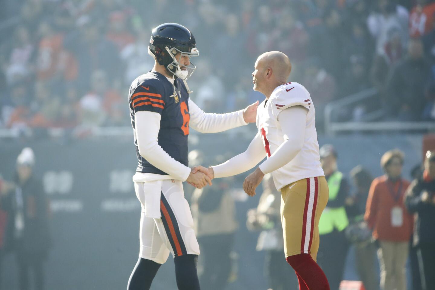 Chicago Bears quarterback Jay Cutler shakes hands with San Francisco 49ers kicker Phil Dawson after the coin toss before the start of the game at Solider Field Sunday, Dec. 6 2015, in Chicago.