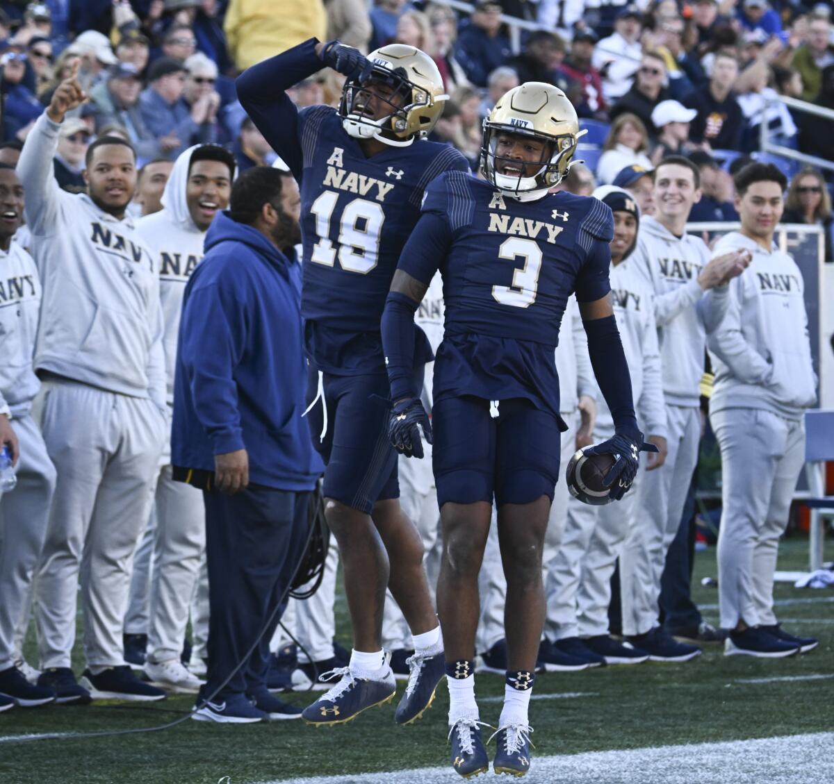 Former Sierra Canyon star Elias Larry (3) and teammate Rayuan Lane III celebrate.