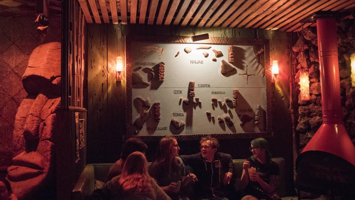 Patrons of Tonga Hut take refuge in the dark and cool environment of the beloved tiki bar in North Hollywood.