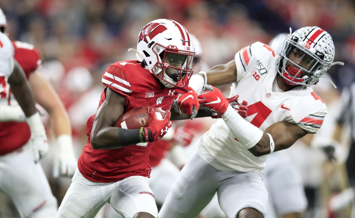 Wisconsin wide receiver Aron Cruickshank runs with the ball against Ohio State in the Big Ten championship game on Dec. 7.