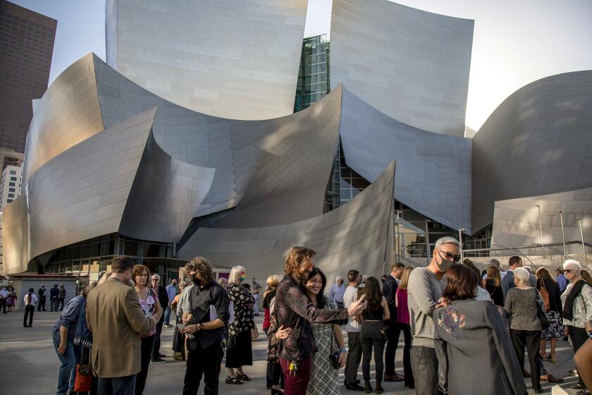 LOS ANGELES, CA - JUNE 26, 2021: Invited guests wait in line outside the Walt Disney Concert Hall to pick up their tickets for the Los Angeles Chamber Orchestra's first public concert since the lockdown on June 26, 2021 in Los Angeles, CA.(Gina Ferazzi / Los Angeles Times)