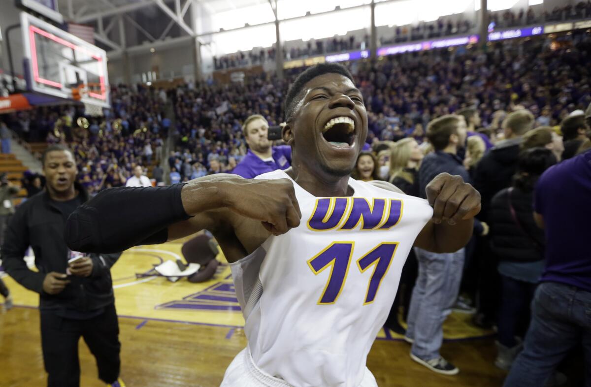 Guard Wes Washpun celebrates after his Northern Iowa's 71-67 victory over North Carolina on Saturday.