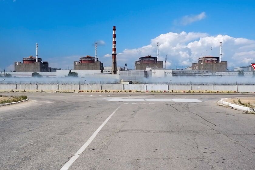 In this handout photo taken from video and released by Russian Defense Ministry Press Service on Sunday, Aug. 7, 2022, a general view of the Zaporizhzhia Nuclear Power Station in territory under Russian military control, southeastern Ukraine. The Russian military said that Ukrainian shelling of the Zaporizhzhia nuclear plant on Sunday caused a power surge and fire and forced staff to lower output from two reactors. (Russian Defense Ministry Press Service via AP)