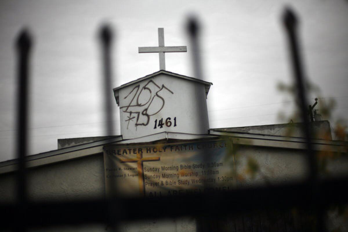 Graffiti mars the steeple on the Greater Holy Faith Baptist Church on 155th Street in Compton in January. 